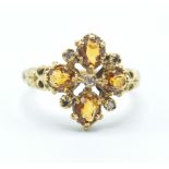 A 20th Century hallmarked 18ct gold Renaissance style ring being set with four oval cut yellow