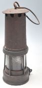 A 19th century Victorian miners lamp with hook swing handle, brass and metal body united by rivets