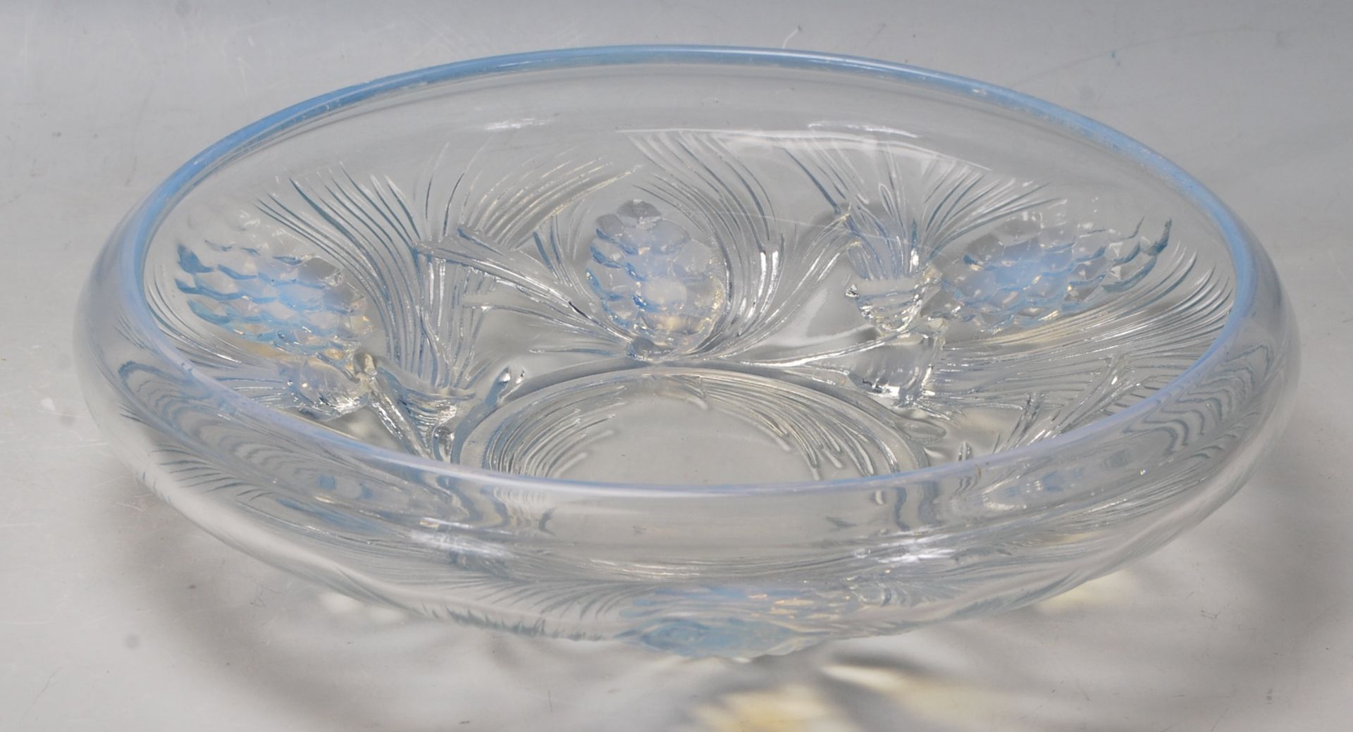 A mid 20th century retro vintage opalescent glass bowl with raised moulded floral decoration to