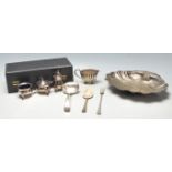 A collection of silver plated wares to include a set of silver plated cruets to include a matching
