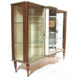 A 1930's Art Deco melamine breakfront china display cabinet / vitrine. Raised on tapering legs