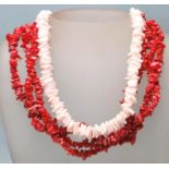 A 20th Century coral necklace having three strands of threaded coral together with a light pink