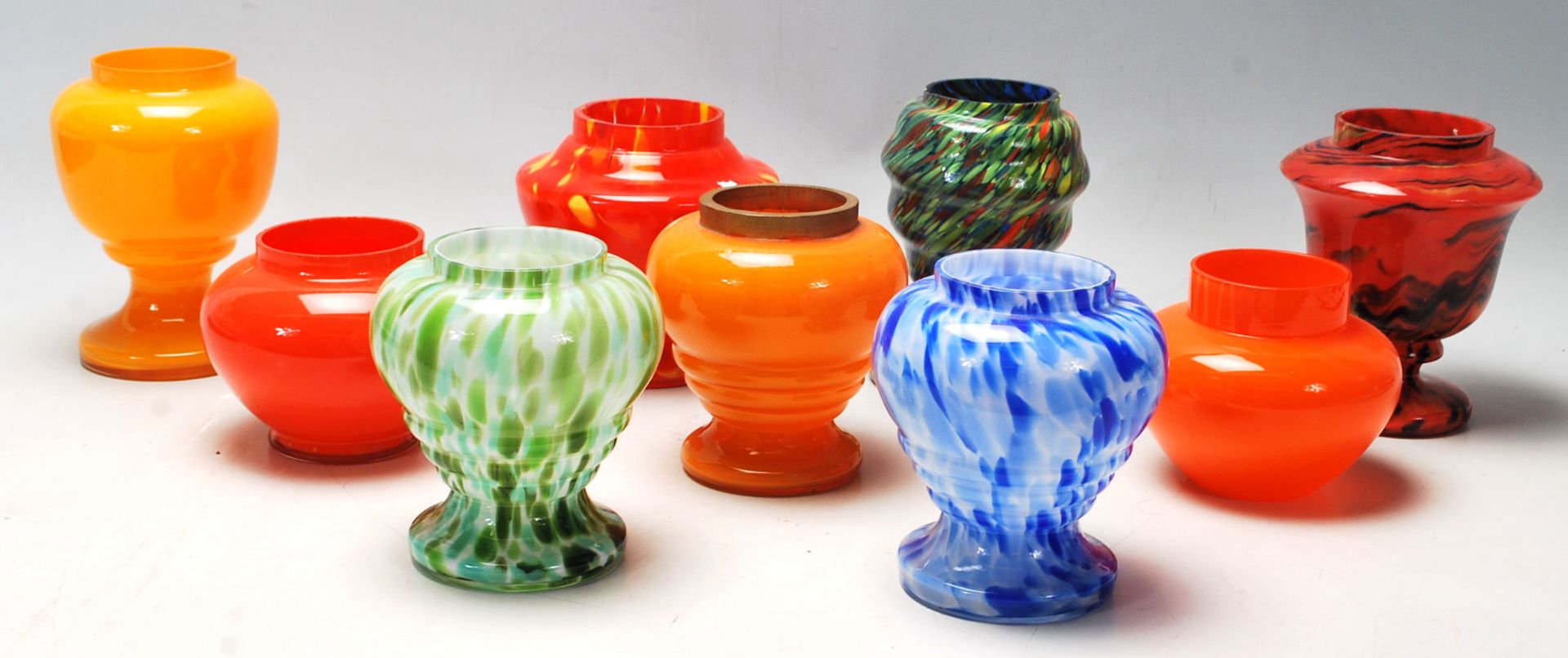 A collection of nine vintage 20th Century Czechoslovakian studio art glass vases in orange, blue