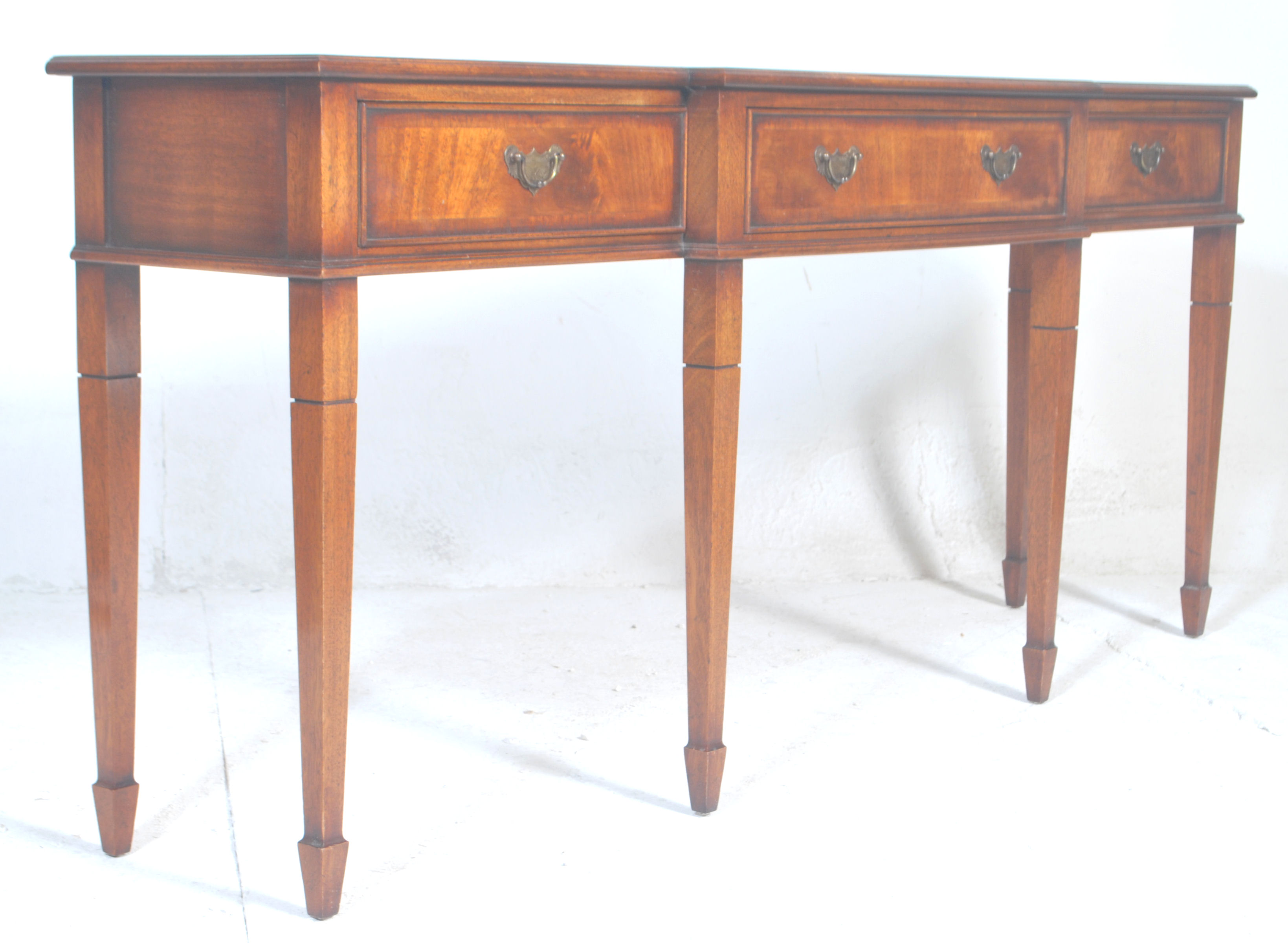 A good Regency revival mahogany breakfront console table.  The console being raised on square