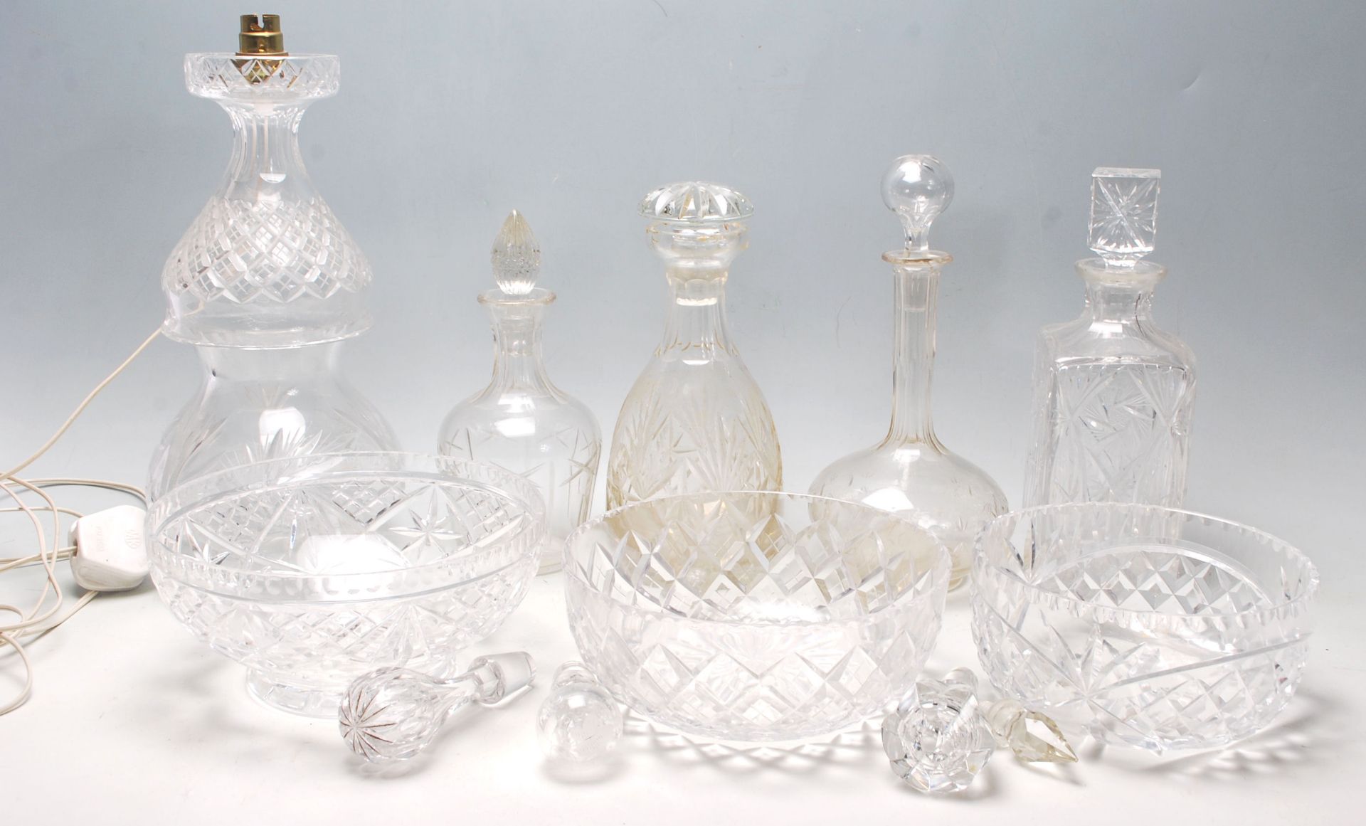 A collection of 20th Century cut glass items to include two large cut glass centrepiece bowls,