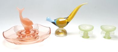 A collection of mid 20th century glass items to include a pair of uranium glass butterfly