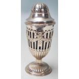 A 20th Century Edwardian style sugar shaker in the shape of a classical urn having a pierced lid and