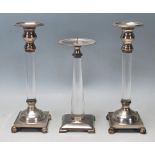A collection of 20th century silver plated and Perspex candlesticks having square bases, Perspex