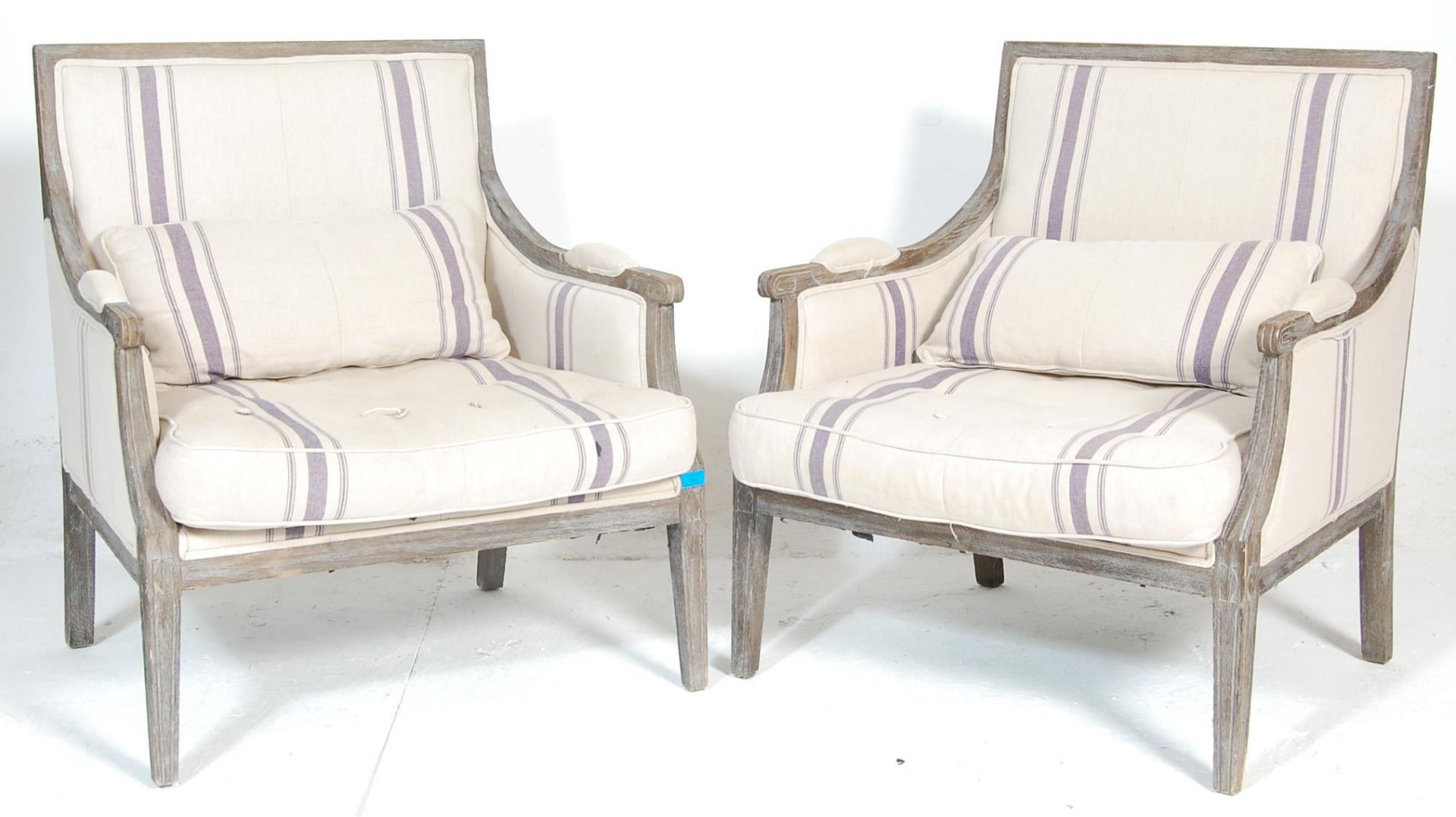 A pair of large 19th Century style French bergere fauteuils /  armchairs of low and wide form.