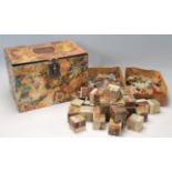 A late 19th century Victorian paper mache decorated box housing a Victorian wooden block puzzle