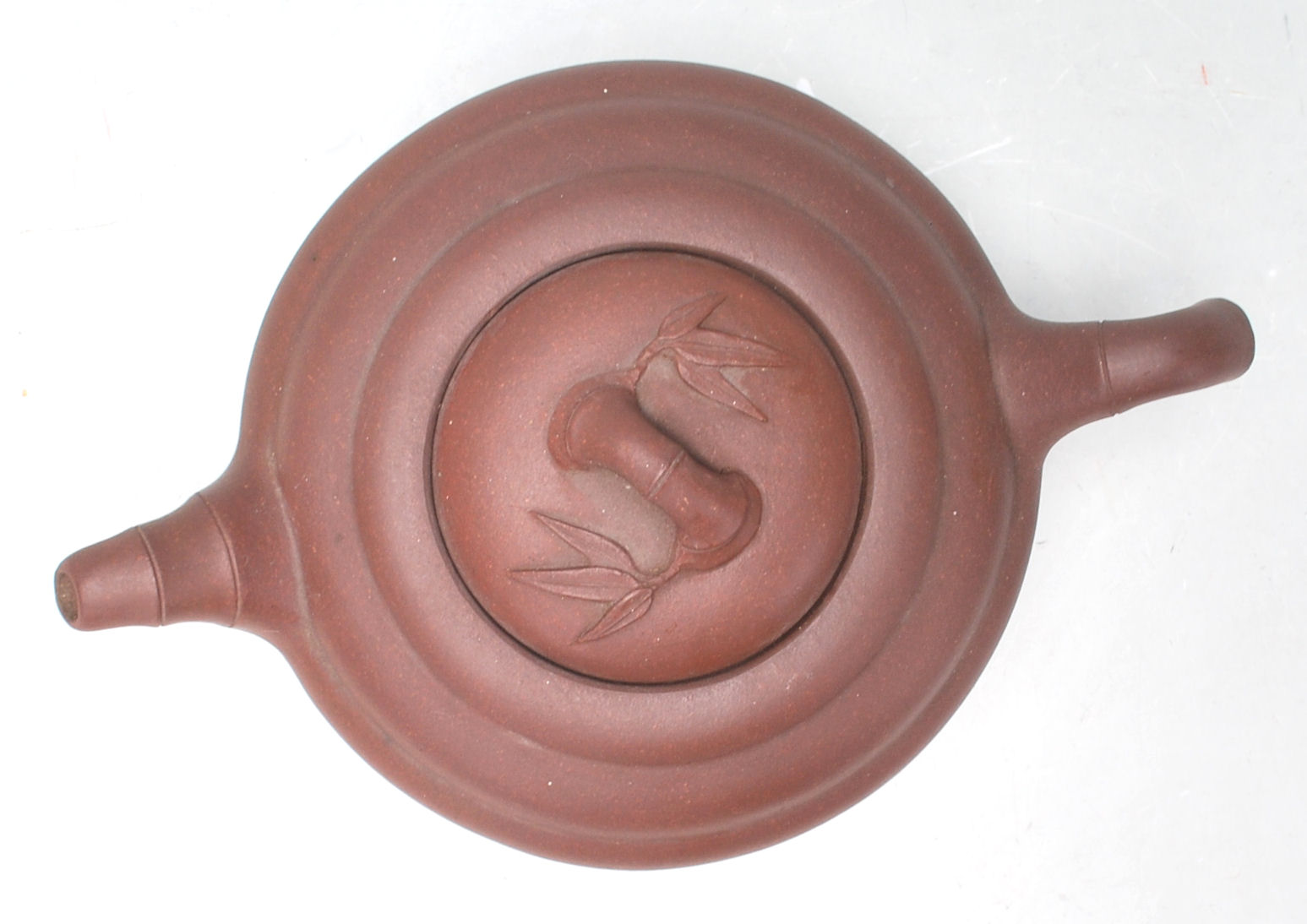 A 20th Century Chinese red clay Yi Xing teapot of round stepped form having a bamboo formed spout - Image 5 of 7