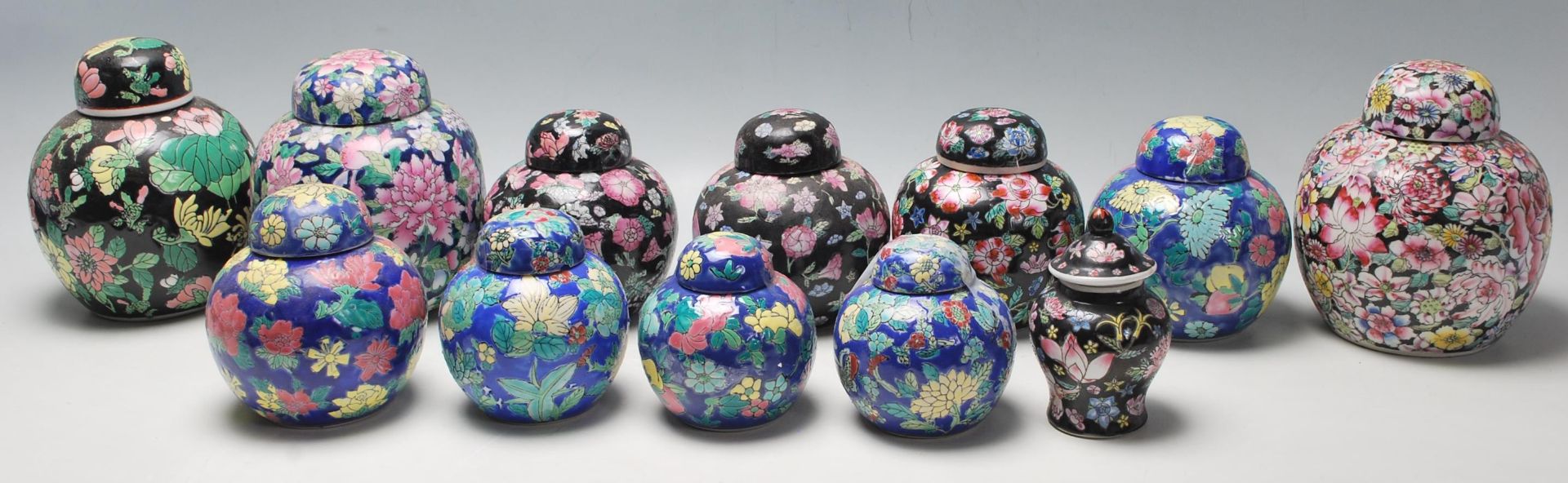 A collection of twelve 20th Century Chinese ginger jars all having hand enamelled floral sprays
