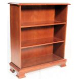 A good quality Queen Anne revival  mahogany open window bookcase having  a flared edge and shaped