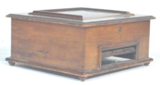 An early 20th Century table top polyphon case of square form having a panelled lid with inlaid