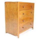 A 20th Century, circa 1940's oak chest of drawers having four double drawers with cast metal knob