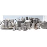 A substantial collection of 20th Century German pewter drinking / mugs / flagons / steins, each