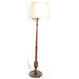 An Edwardian / early 20th century floor standard lamp of mahogany construction.The lamp with a