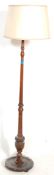 An Edwardian / early 20th century floor standard lamp of mahogany construction.The lamp with a