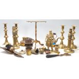 A collection of 20th Century brassware to include four knopped candlesticks, a trivet with pierced