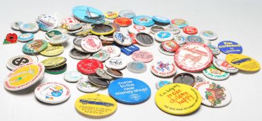 A collection of vintage retro 1970's / 1980's advertising / charity badges to include various Hostel