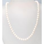 A hallmarked 9ct gold ladies cultured pearl necklace having a strand of spherical pearls set with
