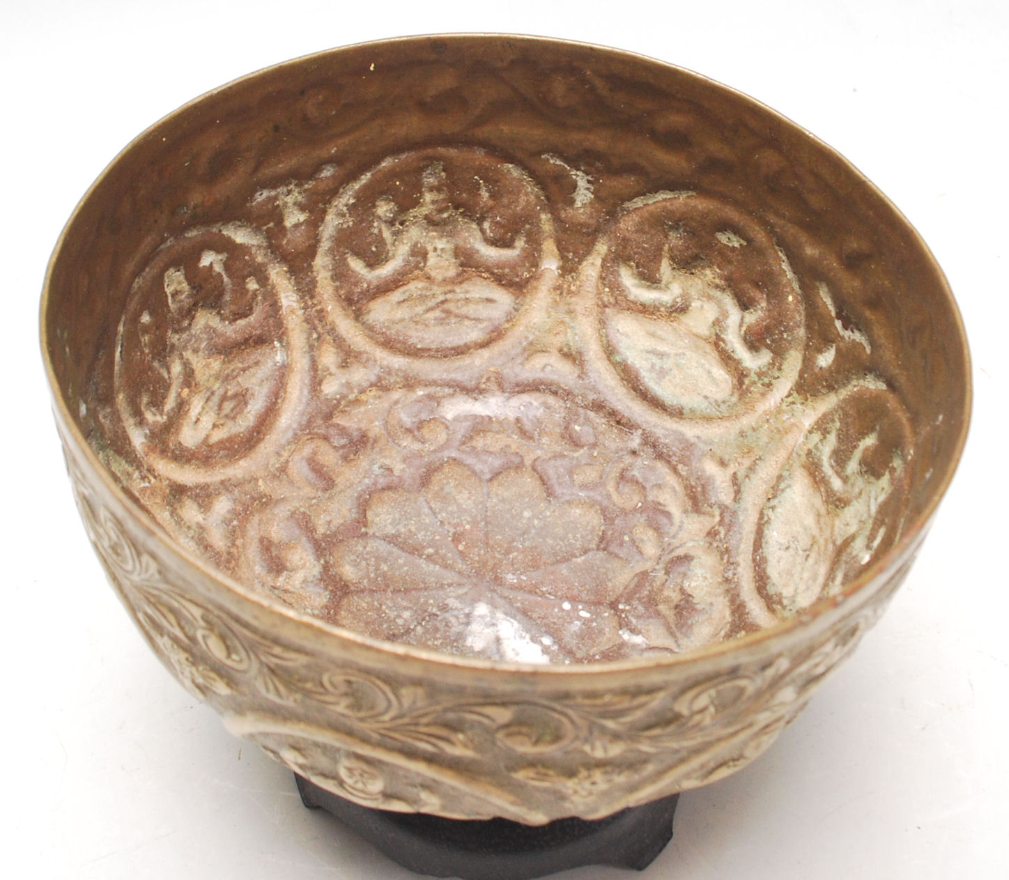 An antique Middle Eastern brass prayer bowl with hand-carved religious figurine to the centre, - Image 4 of 5