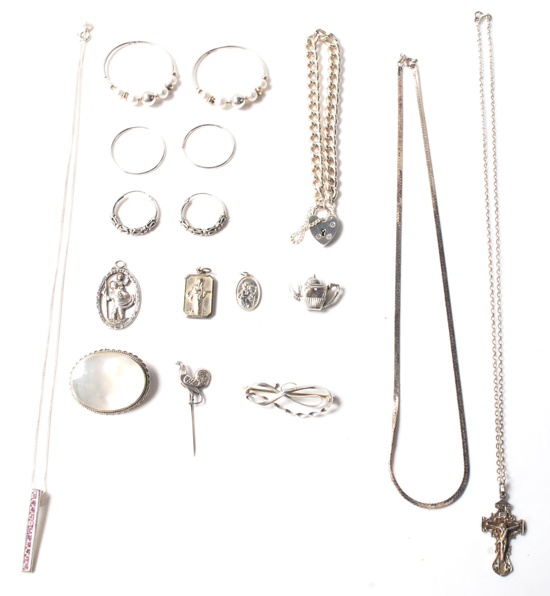 A large collection of hallmarked sterling silver jewellery to include a solid silver bracelet with