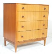 A vintage mid Century Danish manner teak wood chest of drawers. The chest having a bank of 4