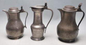 A group of 19th century Victorian pewter jugs with seashell and acorn decoration