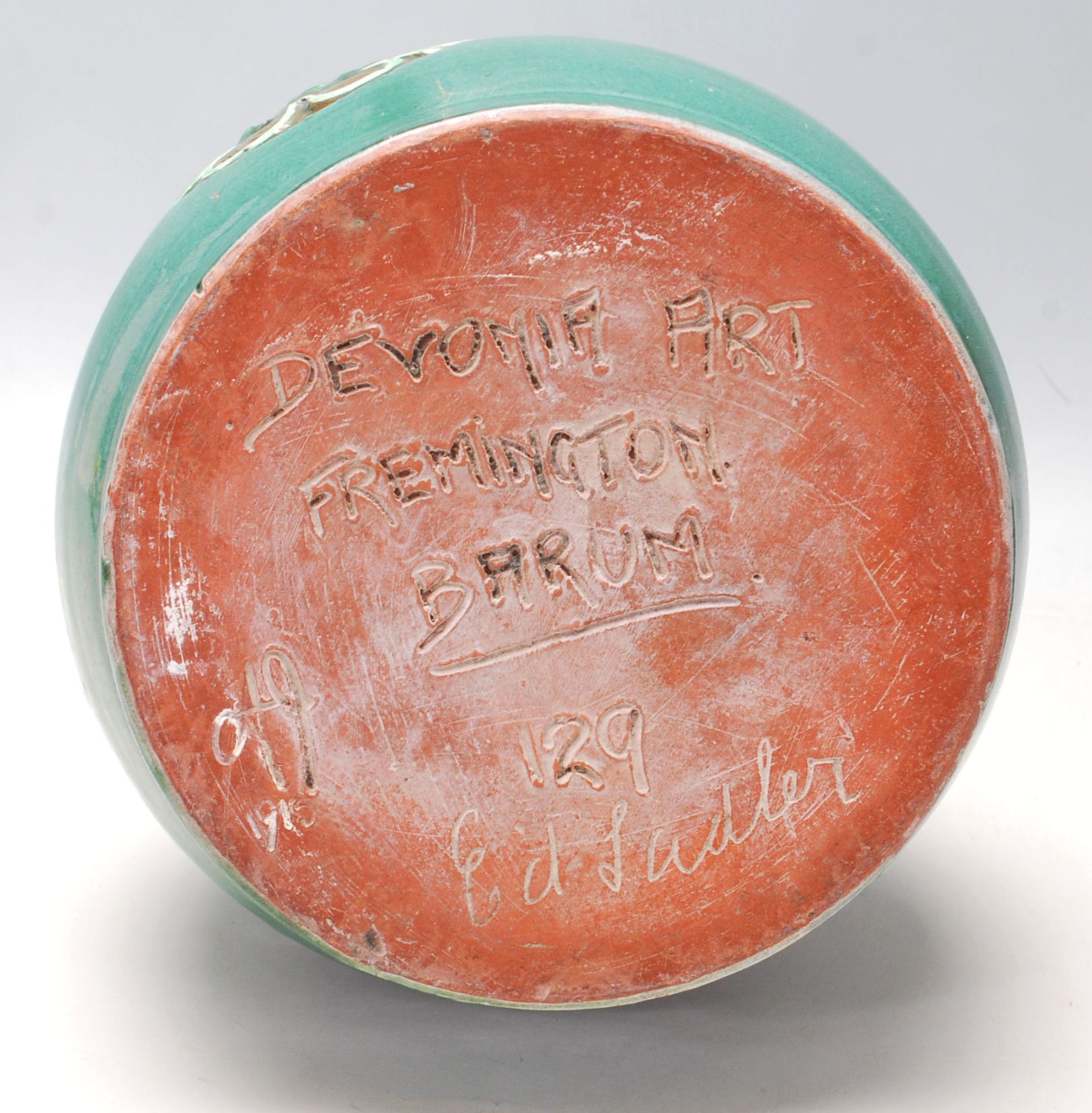 An early 20th Century Devonia Art Fremington Barum terracotta vase by Ed Judler in a bulbous form - Image 6 of 6