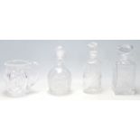 A group of 20th Century cut glass decanters to include a whiskey decanter, bottle decanter, and