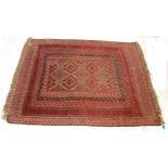 A good early 20th Century hand woven Persian / Islamic floor rug carpet having a red ground with