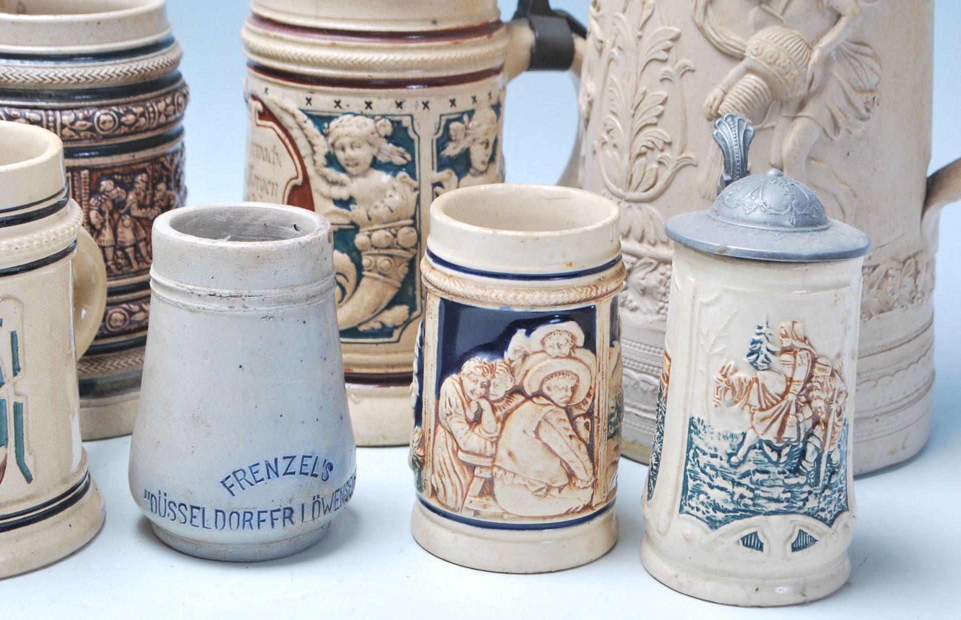 A large collection of German blue and grey stoneware jugs and beer steins, some having pewter - Image 8 of 11