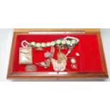 A collection of antique and vintage costume jewellery including a cameo brooch, silver siam bell