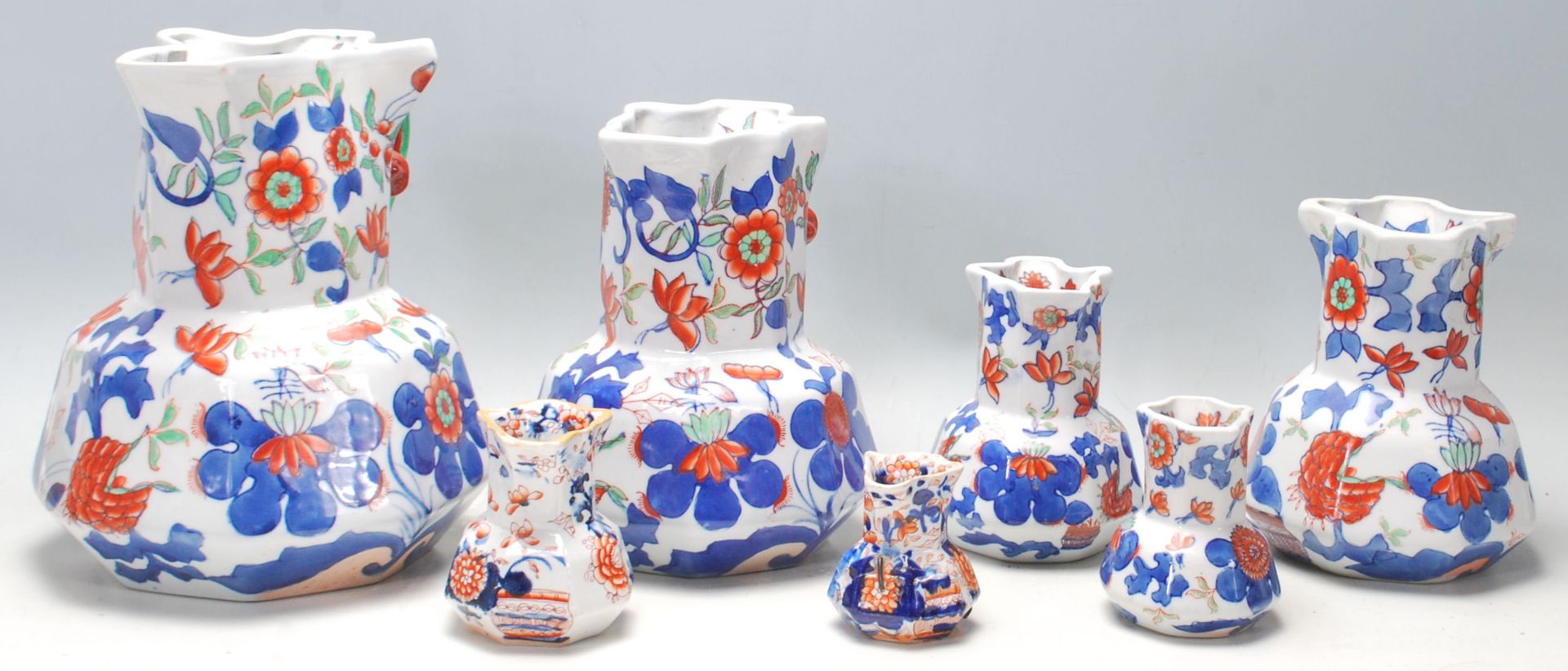 A group of seven early 19th Century graduated Mason patent Ironstone China jug having colourful - Bild 3 aus 4