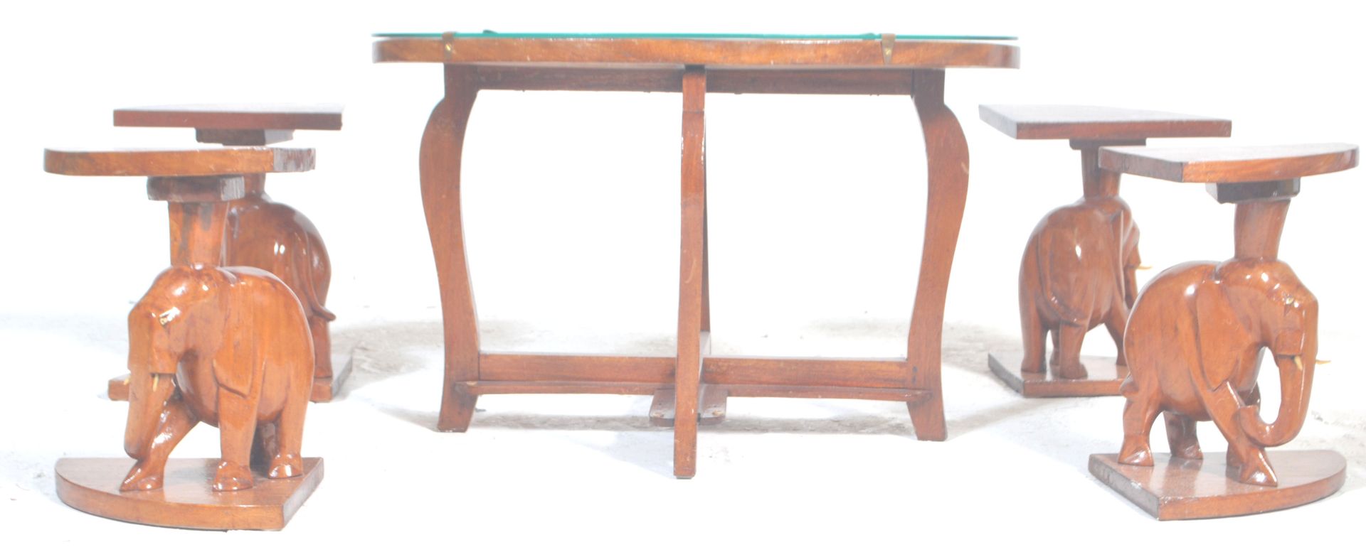 A vintage 20th Century African tribal carved wooden nest of tables having a carved top depicting a - Bild 5 aus 7