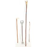 A group of four vintage 20th Century walking sticks to include a wooden and metal shooting stick,