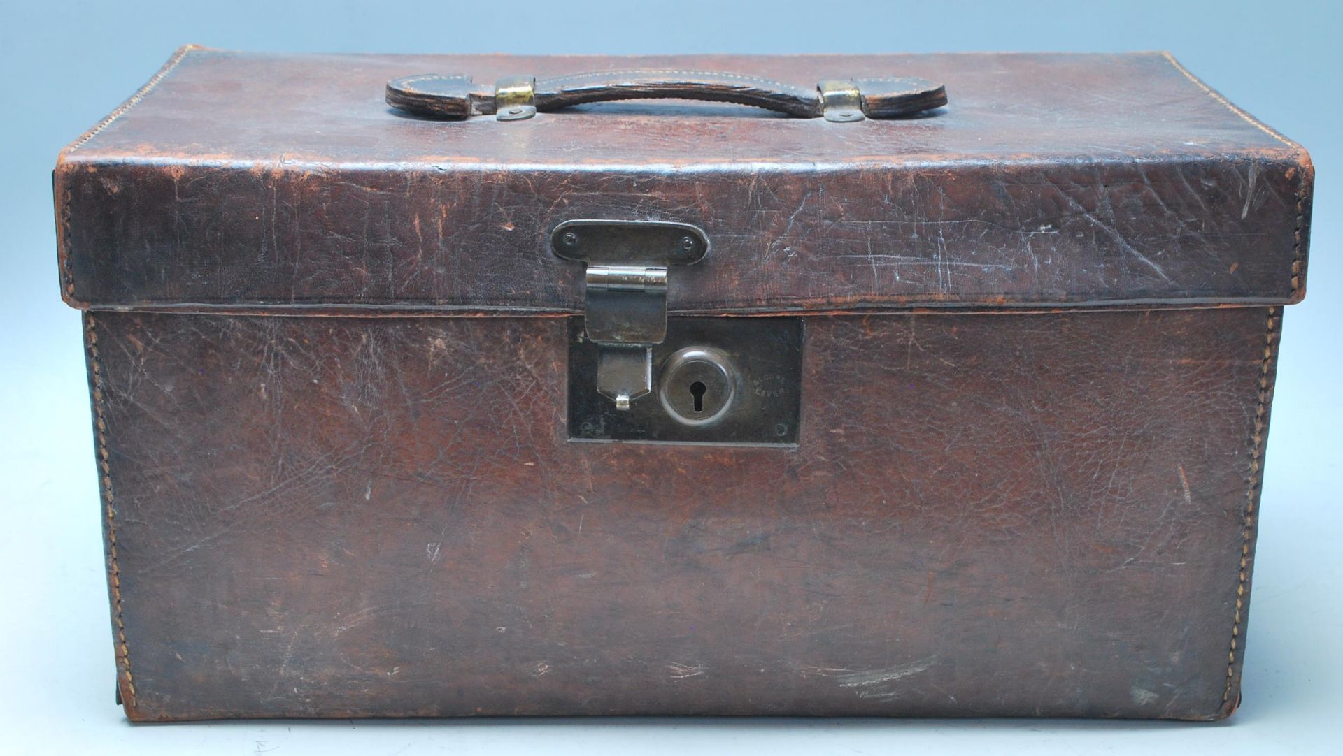 An Antique 20th Century Leather trunk / doctors / Gladstone bag of square form with a makers mark