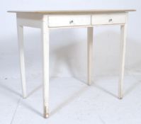 A retro vintage 20th century white farmhouse style writing table.desk. The table having twin drawers