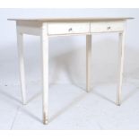 A retro vintage 20th century white farmhouse style writing table.desk. The table having twin drawers