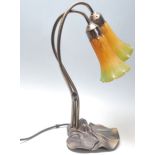 A 20th Century Tiffany style desk / table lamp having two yellow and green mottled glass shades