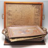 A good collection of antique serving trays to include a glazed map of Wales by John Speed, Indian