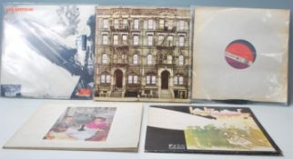 A group of five vinyl long play LP record albums by led Zeppelin to include a brand new and sealed