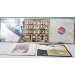 A group of five vinyl long play LP record albums by led Zeppelin to include a brand new and sealed