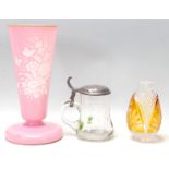 An antique Victorian opaline glass large pink trumpet vase with raised enamel painting together with