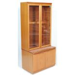 A vintage mid century Danish influenced teak wood highboard - display cabinet unit. The breakfront