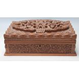 A vintage 20th Century finely carved fruitwood jewellery box having bird and floral decoration