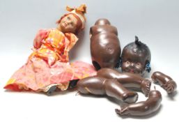 Two vintage dolls to include; a black composition doll (in need of restringing), the second a