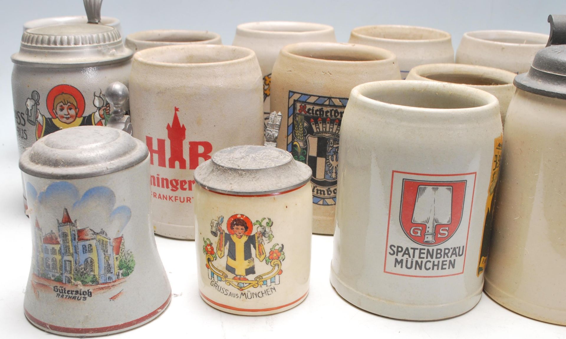 A large collection of 20th Century German blue and grey stoneware jugs and beer steins all having - Image 2 of 7