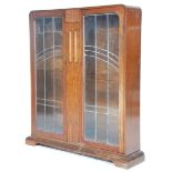An 1930's Art Deco Oak China Display Cabinet vitrine with twin leaded astragal glazed double doors